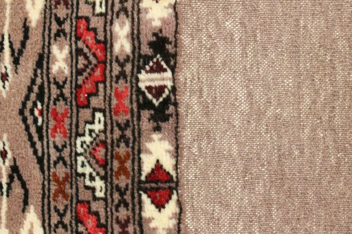Close-up detail of 2000s Torkaman rug from Iran / Persia showing Wool weave
