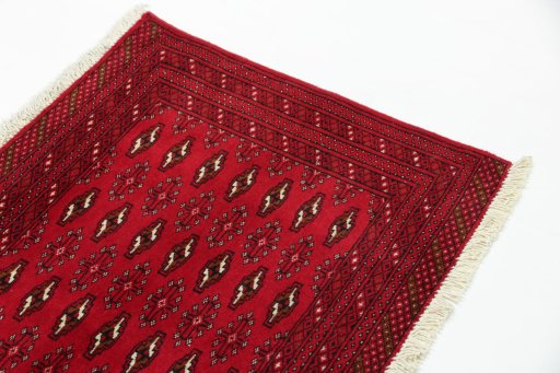 Surface texture of 2000s Torkaman rug with natural Wool and intricate pattern