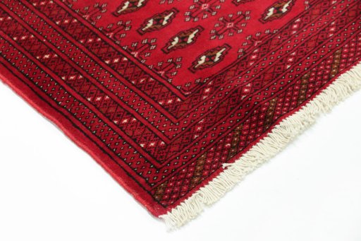 Backside of handmade 2000s Torkaman rug showing knot structure and weave density