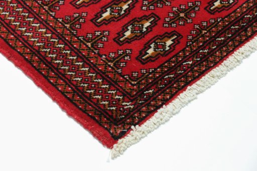 Backside of handmade 2000s Torkaman rug showing knot structure and weave density