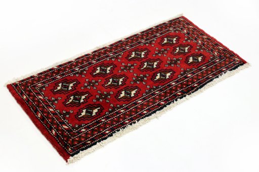 Corner detail of 2000s Torkaman rug showing border pattern and Wool pile