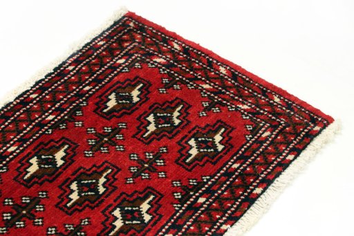 Surface texture of 2000s Torkaman rug with natural Wool and intricate pattern