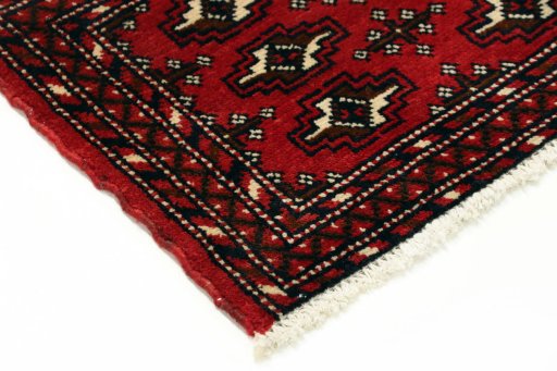 Backside of handmade 2000s Torkaman rug showing knot structure and weave density