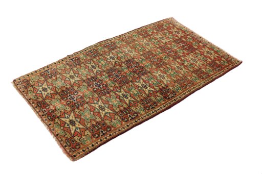 Corner detail of 1990s Torkaman rug showing border pattern and Wool pile
