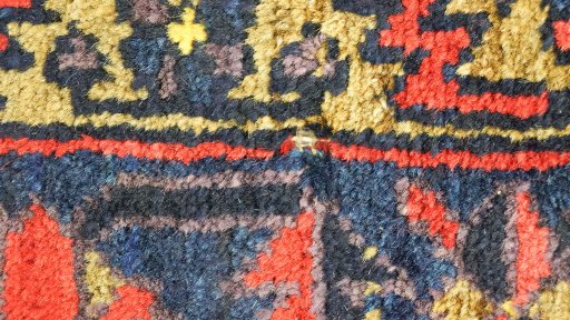Corner detail of 1940s Wiss rug showing border pattern and Wool pile