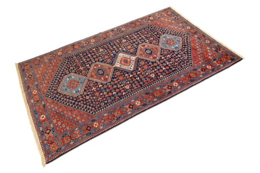 Corner detail of 1990s Yalameh rug showing border pattern and Wool pile