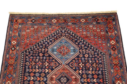 Surface texture of 1990s Yalameh rug with natural Wool and intricate pattern
