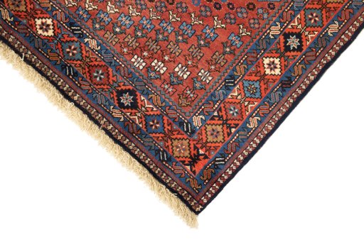 Backside of handmade 1990s Yalameh rug showing knot structure and weave density