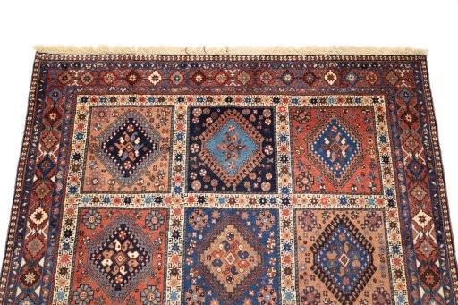 Surface texture of 1990s Yalameh rug with natural Wool and intricate pattern