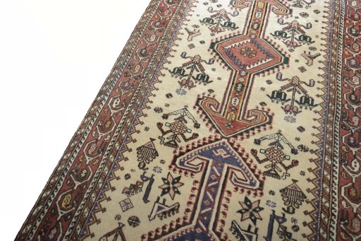 Backside of handmade 2000s Yalameh rug showing knot structure and weave density