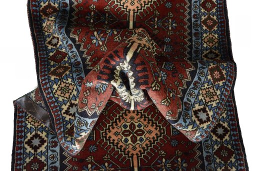 Close-up detail of 2000s Yalameh rug from Iran / Persia showing Wool weave
