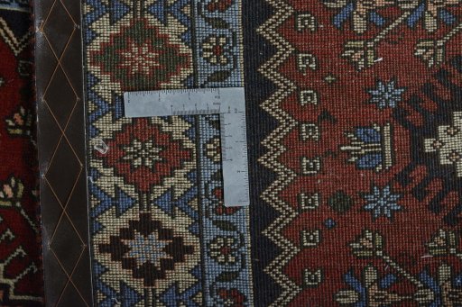 Surface texture of 2000s Yalameh rug with natural Wool and intricate pattern
