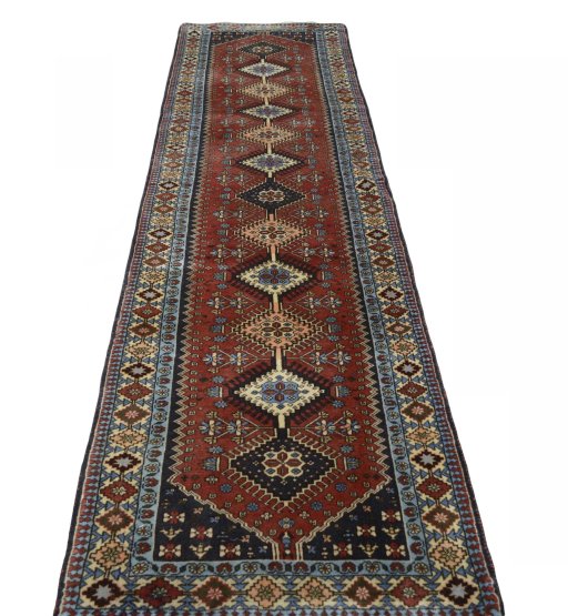 Surface texture of 2000s Yalameh rug with natural Wool and intricate pattern