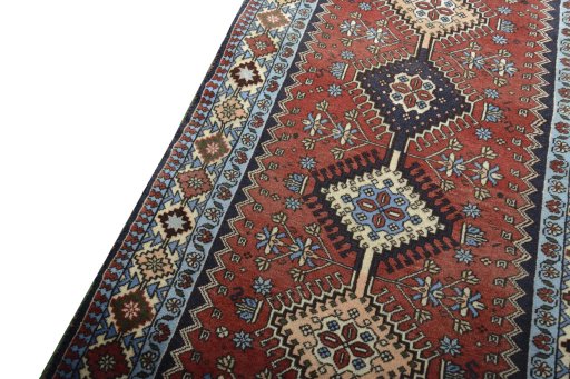 Backside of handmade 2000s Yalameh rug showing knot structure and weave density