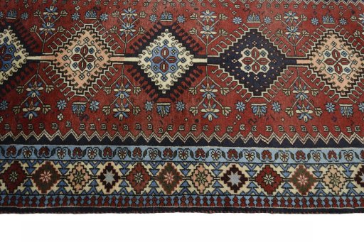 Close-up detail of 2000s Yalameh rug from Iran / Persia showing Wool weave