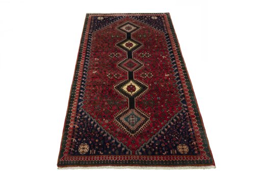 Surface texture of 2000s Yalameh rug with natural Wool and intricate pattern