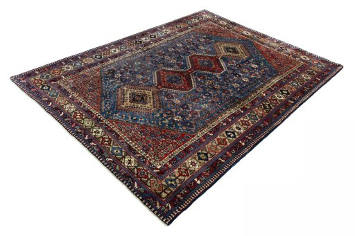 Corner detail of 1970s Yalameh rug showing border pattern and Wool pile