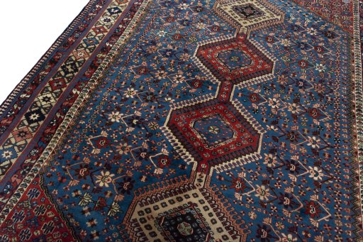 Backside of handmade 1970s Yalameh rug showing knot structure and weave density