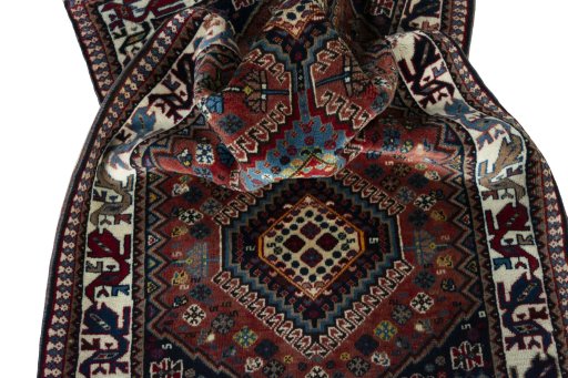 Corner detail of 2000s Yalameh rug showing border pattern and Wool pile
