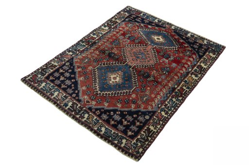 Corner detail of 1970s Yalameh rug showing border pattern and Wool pile