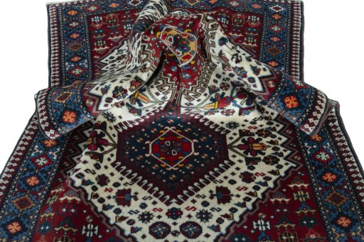 Corner detail of 2000s Yalameh rug showing border pattern and Wool pile