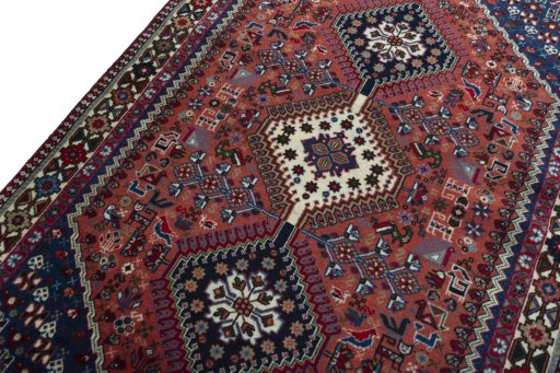 Backside of handmade 2000s Yalameh rug showing knot structure and weave density