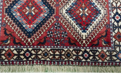 Close-up detail of 2000s Yalameh rug from Iran / Persia showing Wool weave