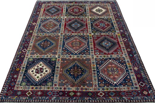Surface texture of 2000s Yalameh rug with natural Wool and intricate pattern