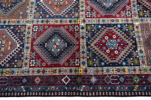 Close-up detail of 2000s Yalameh rug from Iran / Persia showing Wool weave