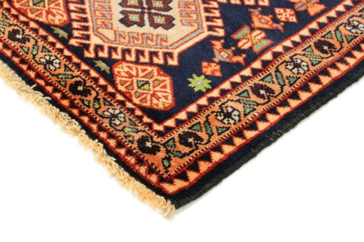 Backside of handmade 1990s Yalameh rug showing knot structure and weave density
