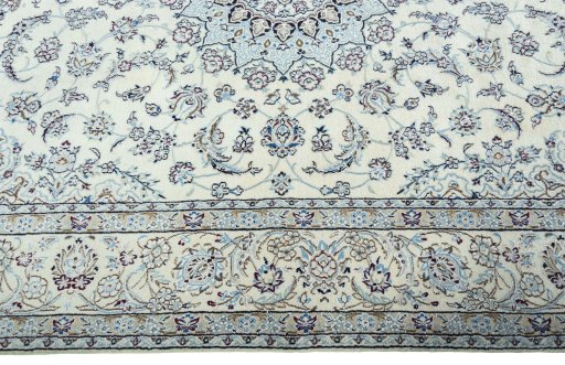 Corner detail of 2000s Nain rug showing border pattern and Wool pile