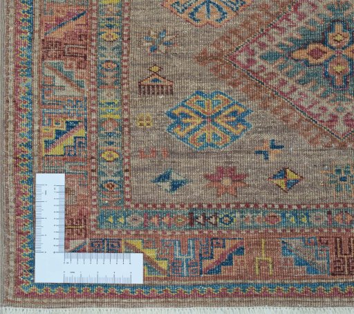 Corner detail of New Kazak rug showing border pattern and Wool pile
