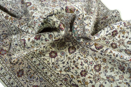 Surface texture of 2000s Kashan rug with natural Wool and intricate pattern