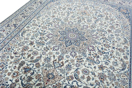 Backside of handmade New Nain rug showing knot structure and weave density