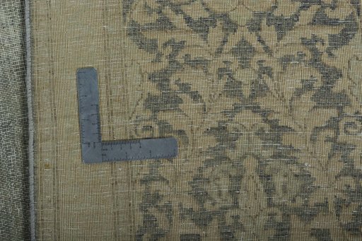 Backside of handmade 1970s Vintage rug showing knot structure and weave density