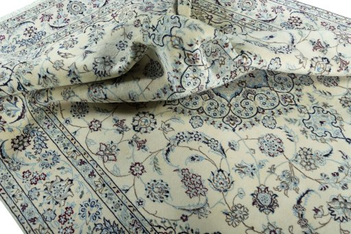Surface texture of 2000s Nain rug with natural Wool and intricate pattern