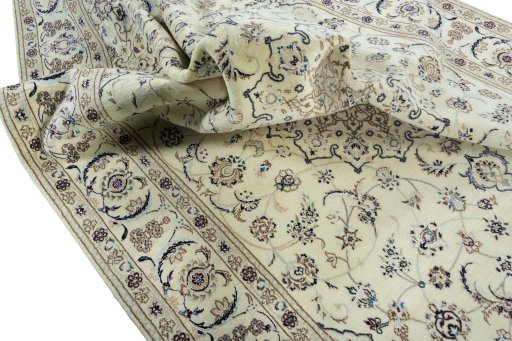 Surface texture of 2000s Nain rug with natural Wool and intricate pattern