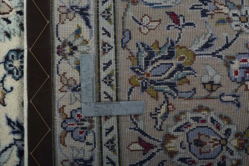 Backside of handmade 2000s Kashan rug showing knot structure and weave density