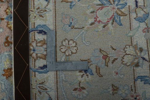 Backside of handmade New Kashan rug showing knot structure and weave density