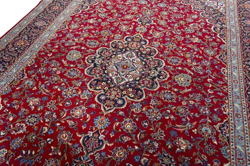 Backside of handmade 2000s Kashan rug showing knot structure and weave density