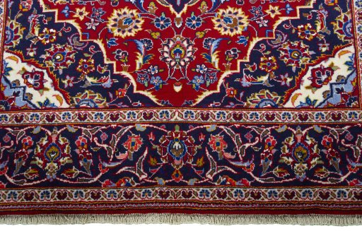 Close-up detail of 2000s Kashan rug from Iran / Persia showing Wool weave