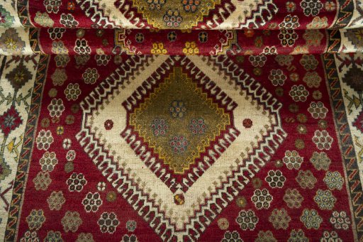 Full view of 1970s Persian Gabbeh rug from Iran / Persia, 235 × 137 cm in Red tones