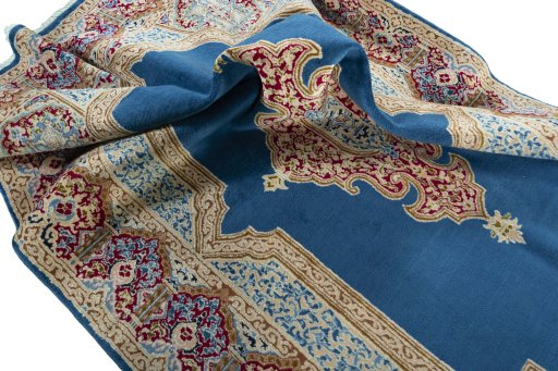 Surface texture of 2000s Kerman rug with natural Wool and intricate pattern