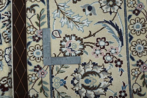 Backside of handmade 2000s Nain rug showing knot structure and weave density