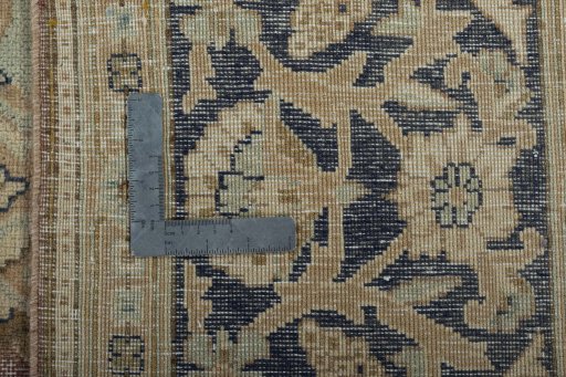 Backside of handmade 1950s Vintage rug showing knot structure and weave density