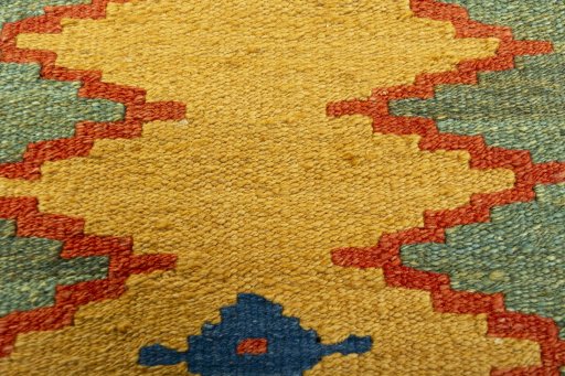 Backside of handmade New Modern Design rug showing knot structure and weave density
