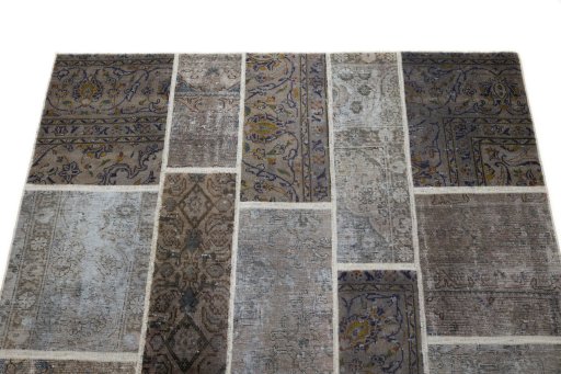 Surface texture of 1960s Patchwork rug with natural Wool and intricate pattern