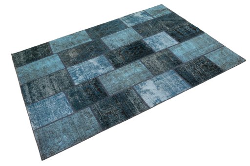 Corner detail of 1960s Patchwork rug showing border pattern and Wool pile