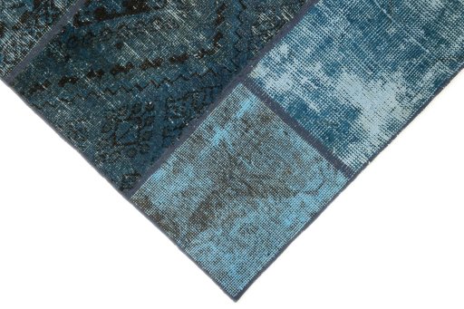 Surface texture of 1960s Patchwork rug with natural Wool and intricate pattern