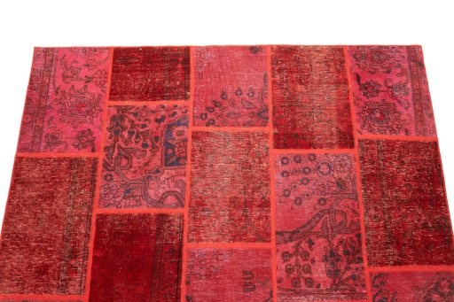 Surface texture of 1960s Patchwork rug with natural Wool and intricate pattern
